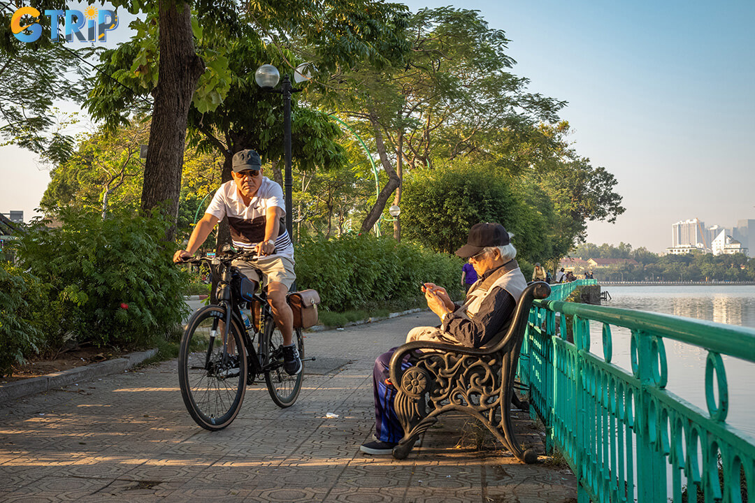 Experience Hanoi’s cultural heart at sunrise, cycling past landmarks like Hoan Kiem Lake, The Huc Bridge, and the bustling Old Quarter