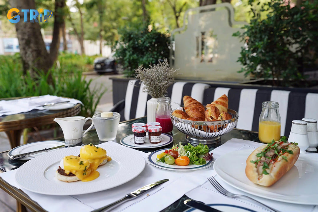 La Terrasse Du Metropole offers a Parisian sidewalk cafe experience with classic French cuisine, vintage charm, and timeless elegance at Sofitel Legend Metropole
