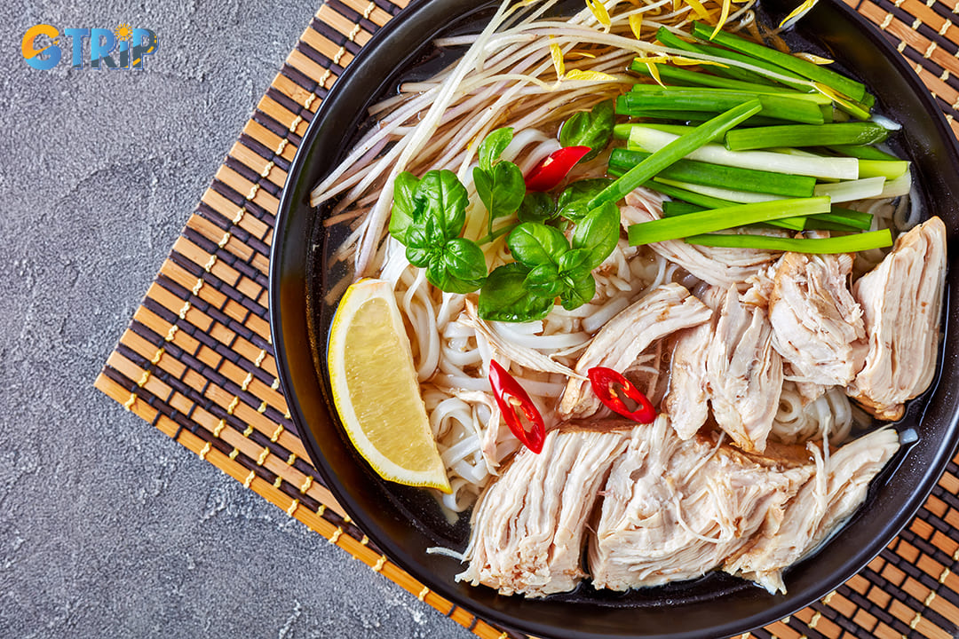 Pho ga with a lighter broth than pho bo is also a must-try dish