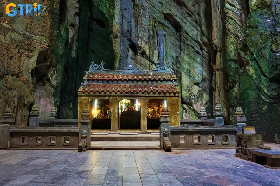 A modern glass elevator at Gate 2 offers a convenient shortcut up the mountain, reducing the climb to Huyen Khong Cave for a small fee