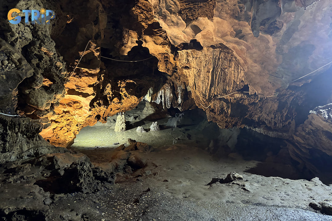 A small lake in the cave creates a dreamlike atmosphere