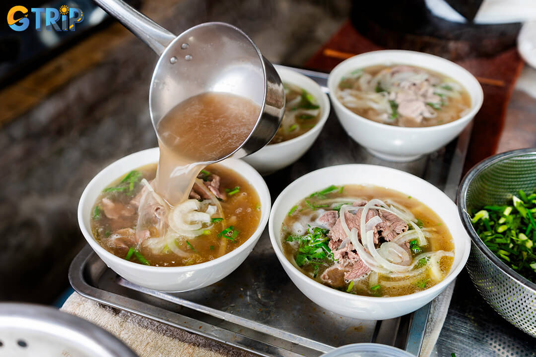 A steaming bowl of Hanoi-style pho is the soul of the city’s breakfast culture and a must-try culinary icon