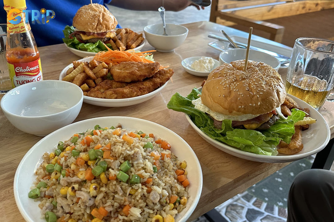 A table full of food and drinks from Tom Bop Bar Restaurant