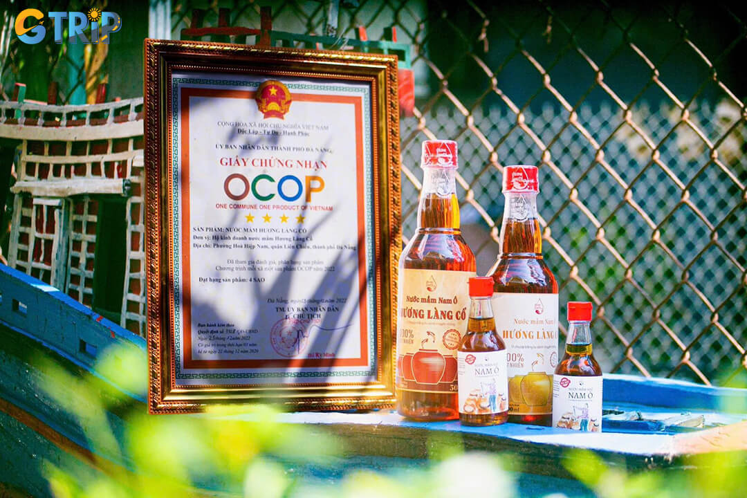 A visit to Nam O Village offers a glimpse into its traditional fish sauce-making craft, where careful fermentation creates the renowned mam nhi