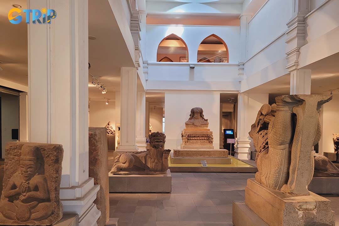 Appreciate the museum itself, where elegant French colonial architecture with high ceilings, arched windows, and open-air corridors uses natural light and airflow