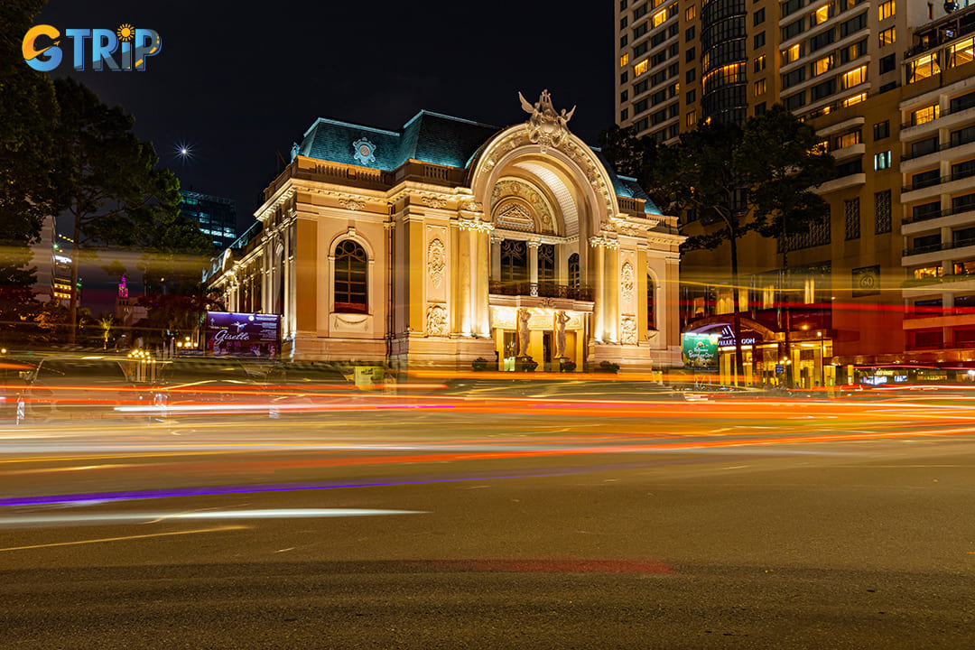 As the sun sets, the Ho Chi Minh City Opera House transforms into a breathtaking spectacle