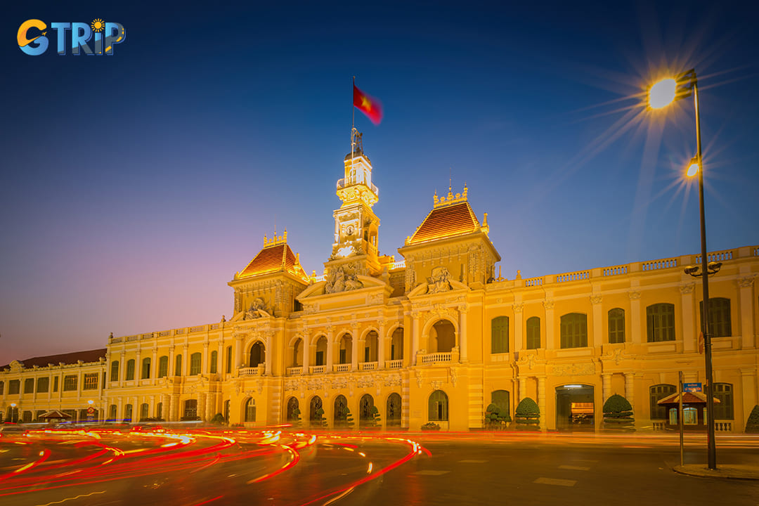 At night, the building is bathed in warm golden lighting
