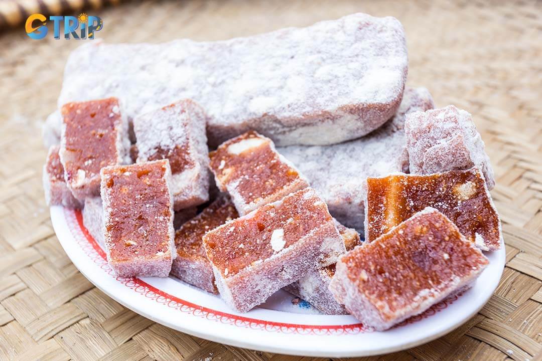 At Perfume Pagoda, indulge in local treats like Banh Giay, sticky rice cakes with mung bean filling, and Che Lam, nutty ginger rice bars, perfect with tea