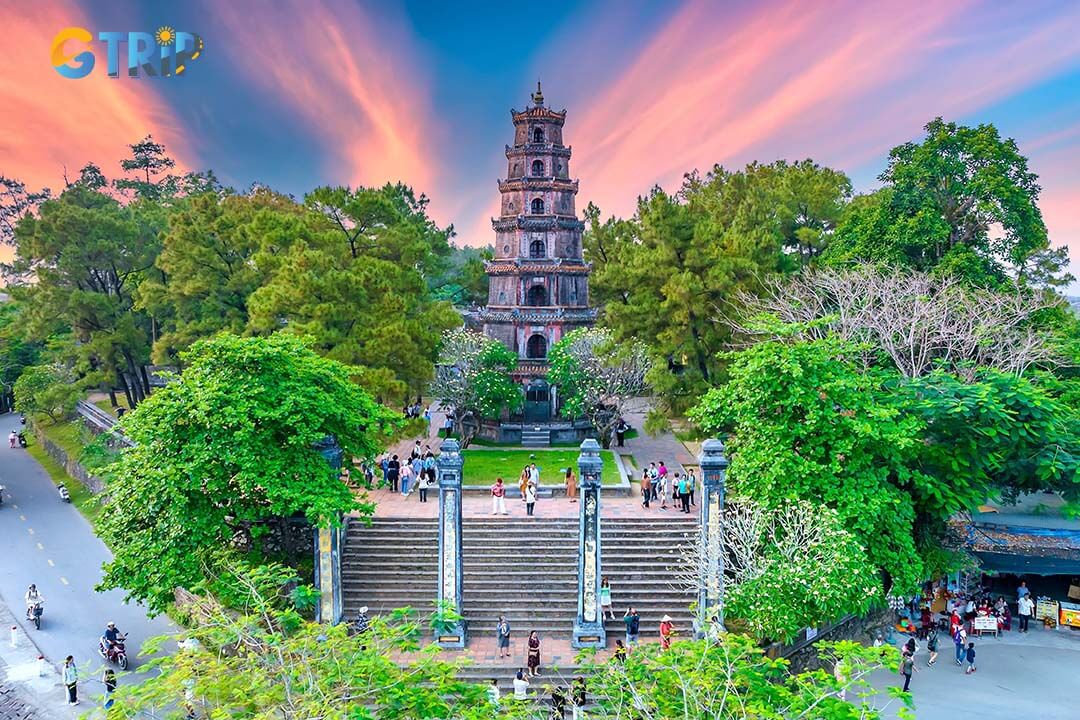Attend a prayer ceremony at Thien Mu Pagoda, where monks chant sutras, ring bells, and light incense in a tranquil, spiritual setting