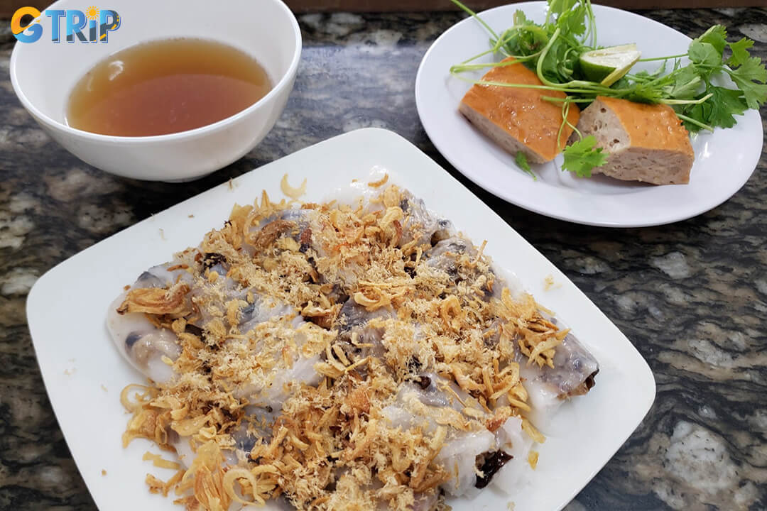 Banh cuon Thanh Van is a Hanoi favorite, known for its silky-thin rice rolls with savory pork-mushroom filling, served fresh with balanced dipping sauce