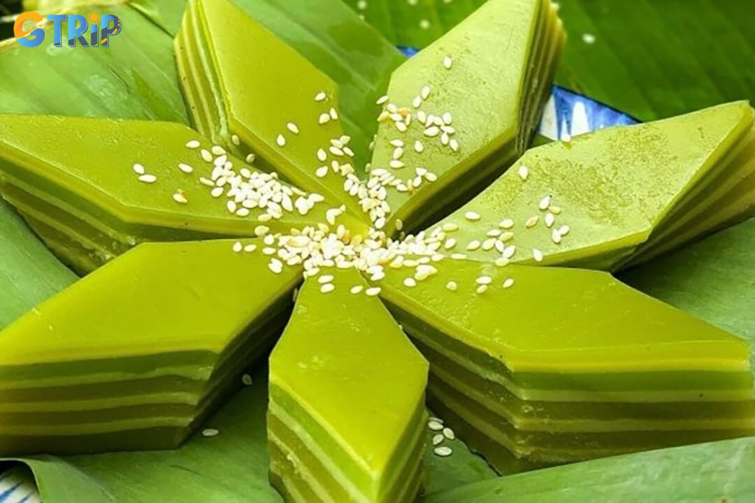 Banh da lon is a colorful Vietnamese steamed layer cake with chewy pandan and mung bean layers, sweet coconut flavor, and a visually appealing texture