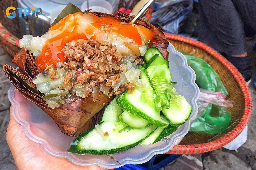 Banh gio is a beloved Hanoi street food featuring a pyramid-shaped rice flour dumpling with savory pork filling, wrapped in banana leaves