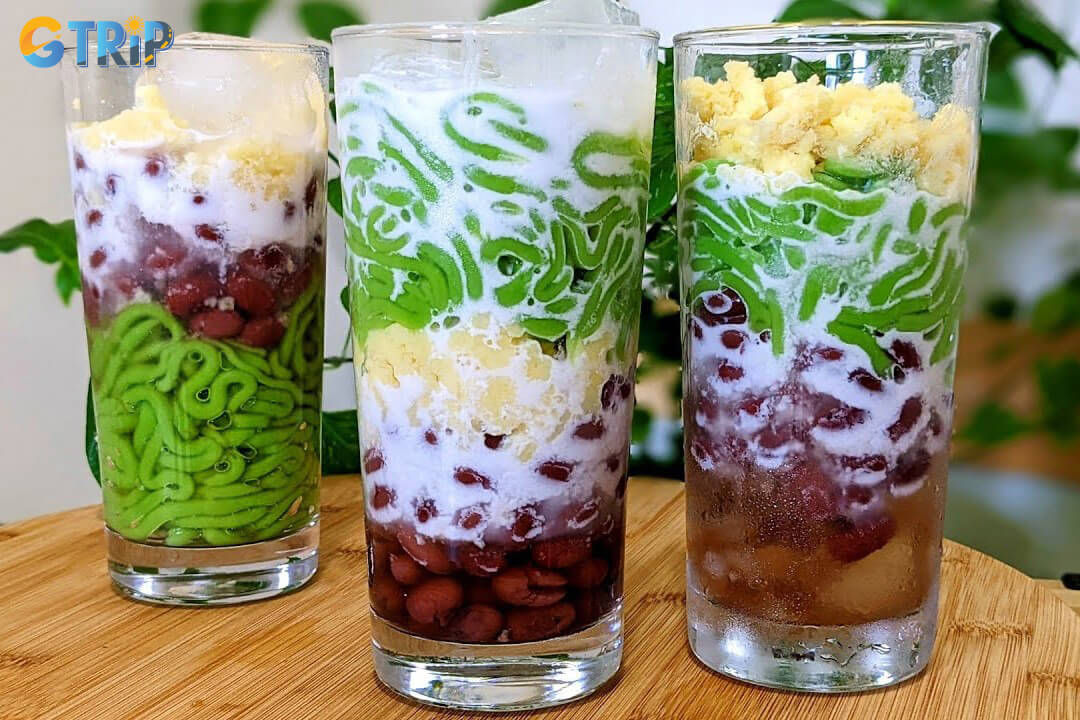 Banh lot nuoc cot dua is a southern Vietnamese dessert of chewy pandan jelly noodles served in sweet coconut milk and crushed ice, fragrant and refreshing