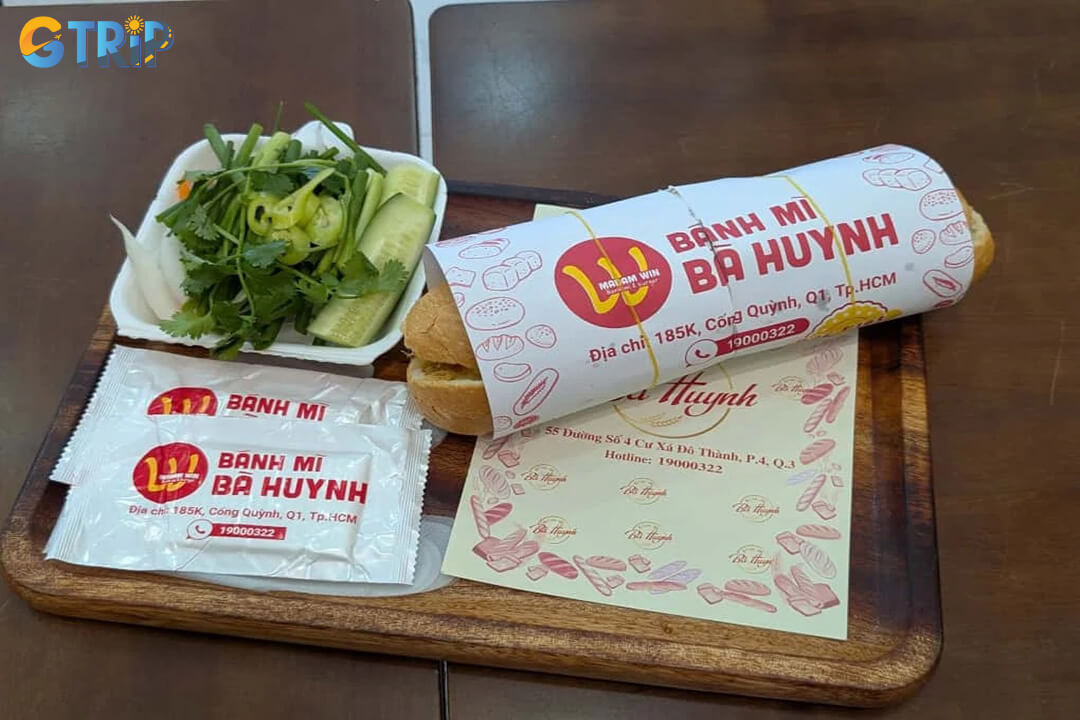 Banh mi Ba Huynh is famous for its massive, generously stuffed sandwiches packed with multiple cold cuts, rich pate, and fresh herbs for a hearty, indulgent meal