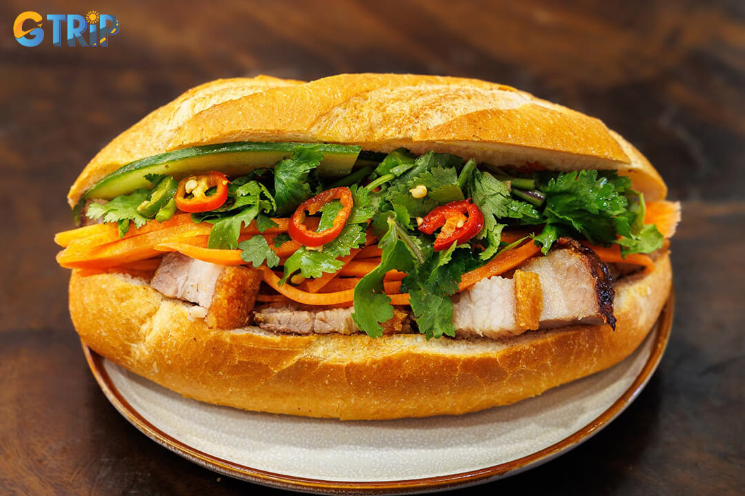 Banh mi Bay Quang specializes in banh mi bi, featuring shredded pork skin with toasted rice, fresh herbs, and pickles for a light, flavorful, and unique sandwich experience