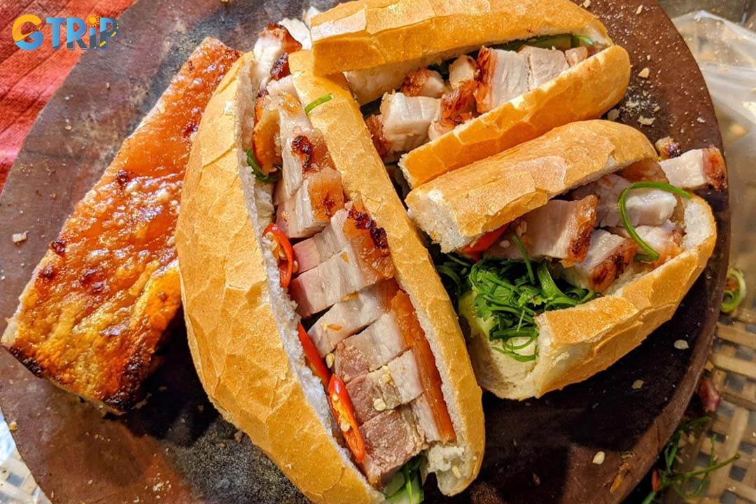 Banh Mi Heo Nuong Lua Ong Phu Dat offers juicy and delicious flame-roasted pork banh mi