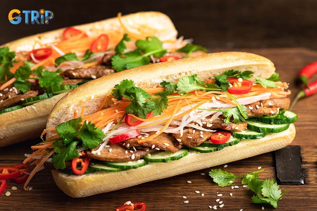 The Banh Mi thit nuong features smoky, lemongrass-grilled pork balanced by fresh pickles, herbs, and a touch of savory sauce