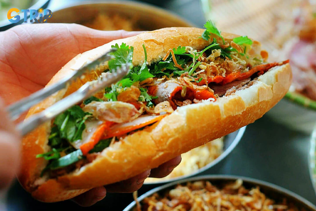 Banh mi, Vietnam's iconic sandwich, represents the perfect fusion of French and Vietnamese culinary traditions