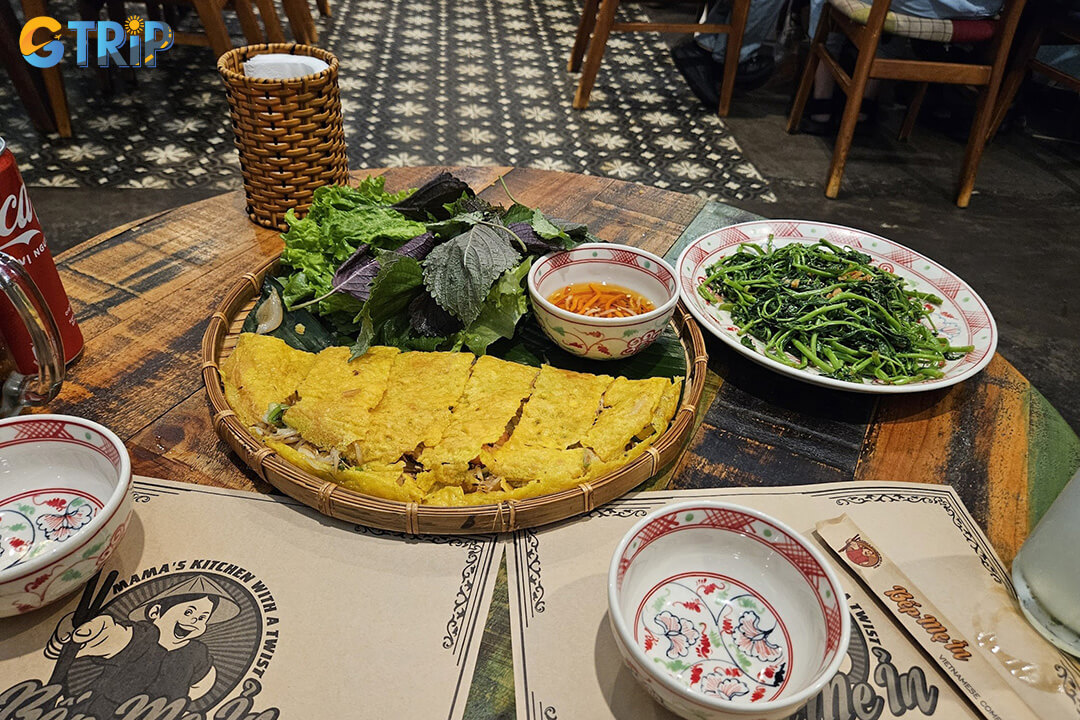 Bep Me In offers a cozy, home-style setting with elegantly crisp Banh Xeo filled with fresh shrimp, tender pork, and bean sprouts