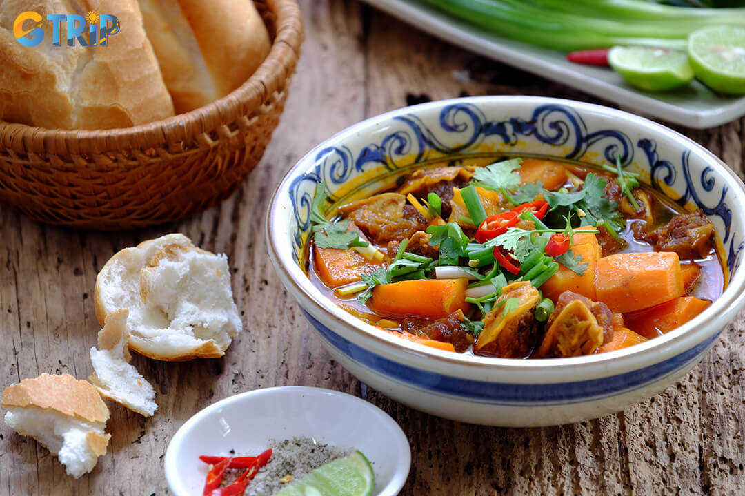 Bo kho is a fragrant Vietnamese beef stew with tender meat, spiced broth, and carrots, served with baguette or noodles for a hearty breakfast