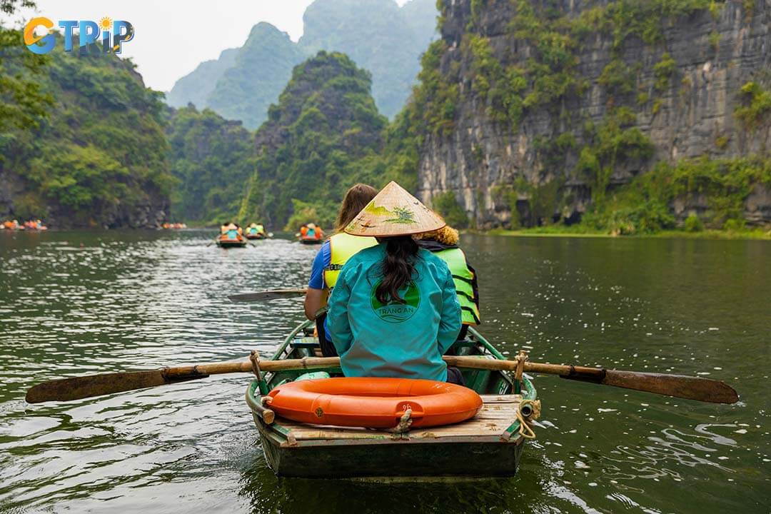 Boat rides in Trang An in the morning provide a captivating experience set against this enchanting backdrop