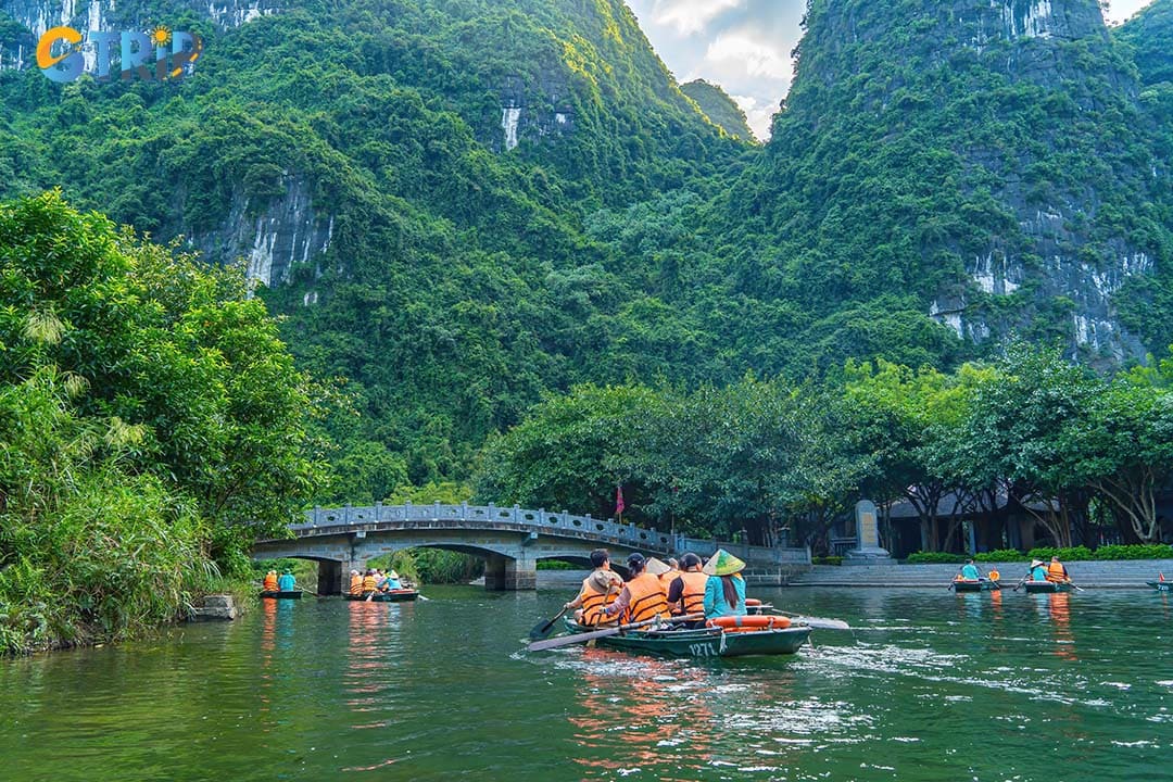 Start your morning with a serene boat tour through Trang An, a UNESCO site of caves, temples, and stunning karst landscapes