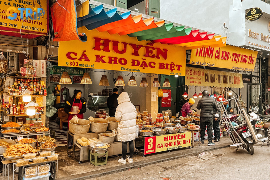 Braised fish (ca kho) is arguably the market's most iconic dish, a true masterpiece of Vietnamese comfort food that often sells out quickly