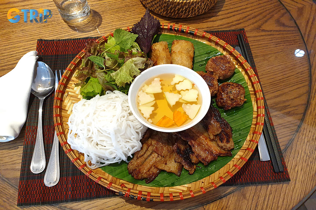 Bun cha features succulent grilled pork patties and slices of pork belly served in a bowl of sweet-savory fish sauce