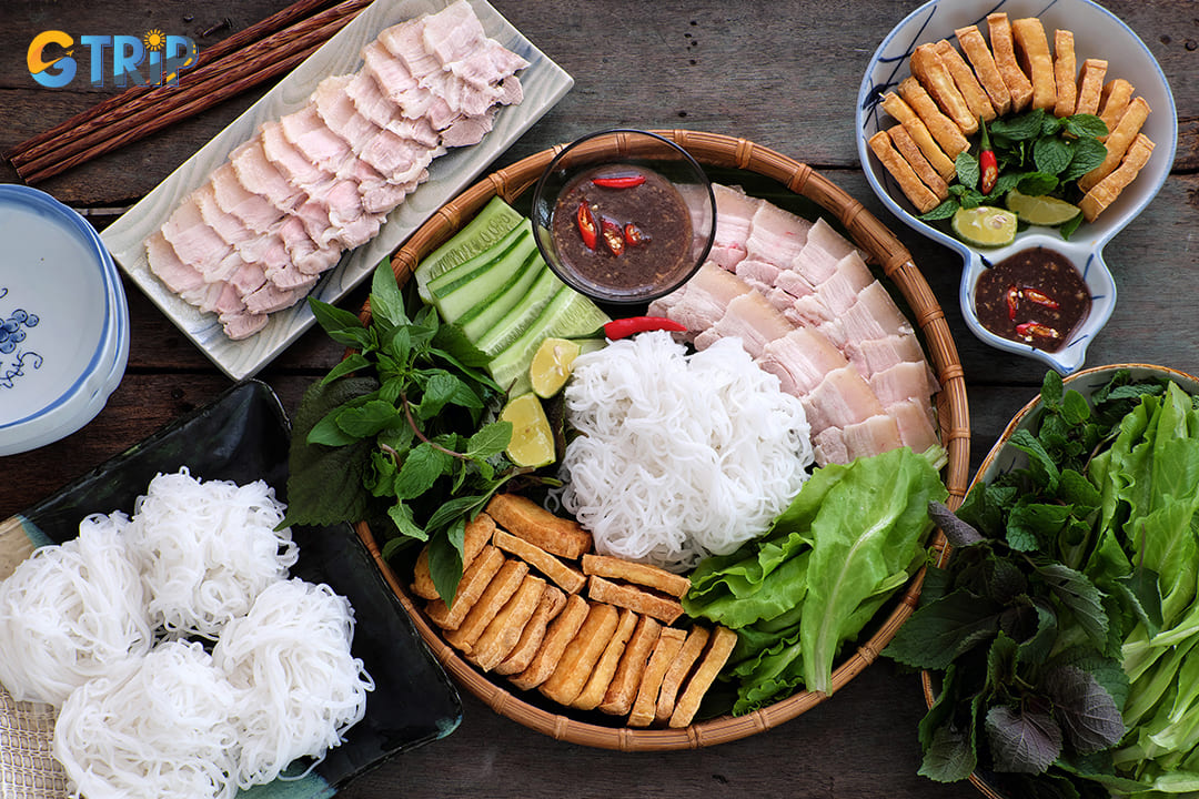 Bun dau mam tom is a beloved Hanoi delicacy featuring fresh rice vermicelli, deep-fried tofu, herbs, and the infamous fermented shrimp paste (mam tom)