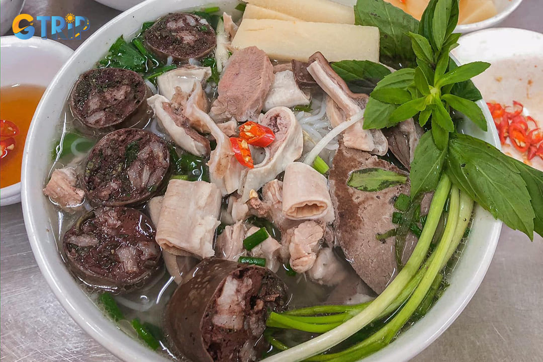 Bun long represents Hanoi's nose-to-tail eating tradition, featuring pork intestines as the star protein