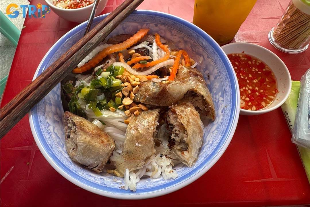 Bun Thit Nuong Cha Gio Nguyen Trung Truc is favorite is known for smoky charcoal-grilled pork served over noodles with fresh herbs and balanced fish sauce