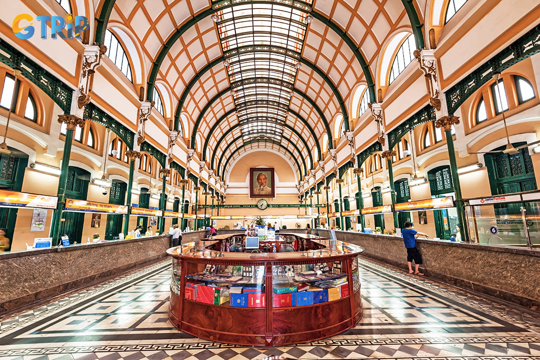 Central to the spatial layout is the long, curved wooden counter, a nod to the building’s continuous operation as a post office