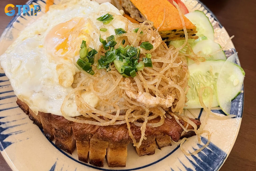 Com Tam Anh in District 4 is a late-night favorite serving tender, smoky baby back ribs and flavorful com tam in a lively, no-frills street food setting