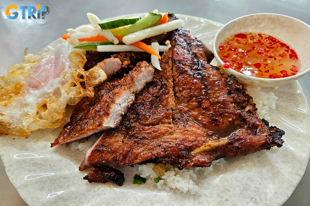 Com Tam Ba Ghien in Phu Nhuan is famous for its colossal, perfectly grilled pork ribs, offering a memorable and indulgent com tam experience for serious appetites