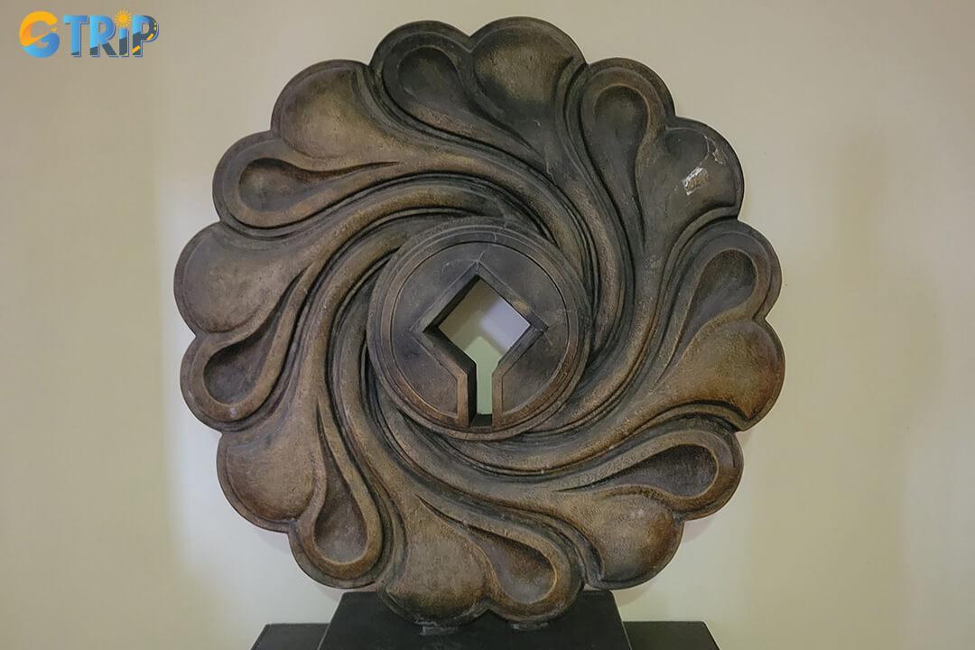 Discover exquisite ceramics from the Maritime Silk Road alongside impressive stone and wood sculptures that showcase the artistry of Hoi An’s craftsmen