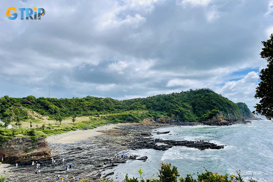 Dragon Claw Rock Beach is renowned for its distinctive rock formations that resemble a dragon's claw extending into the sea