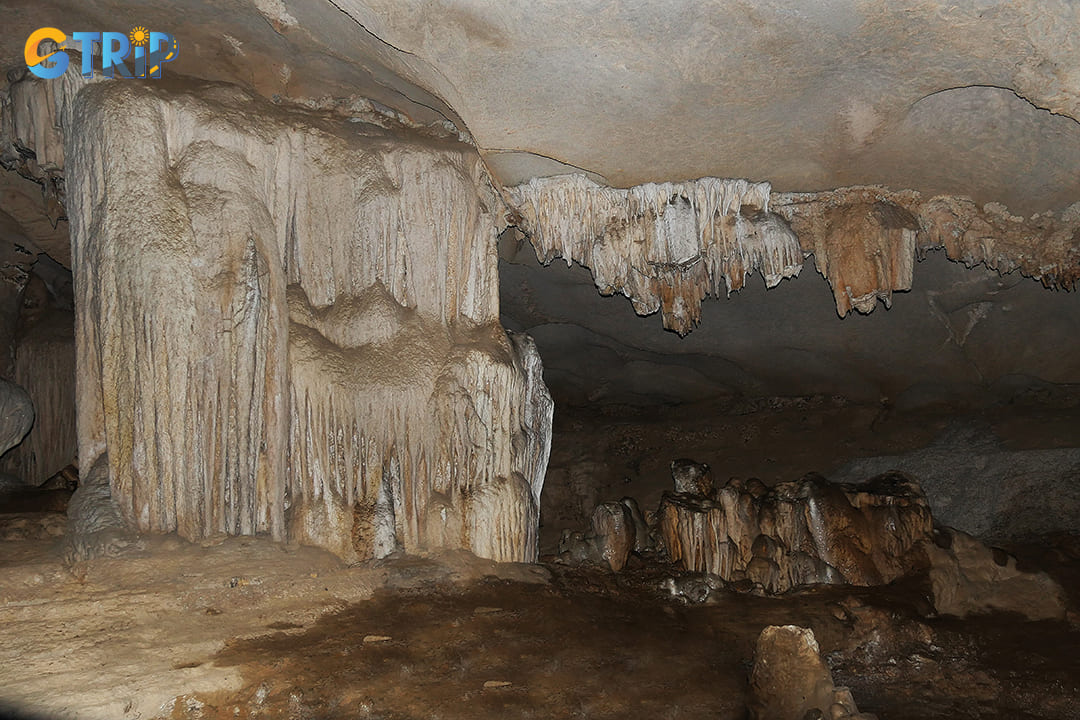 Dramatic limestone formations surrounding the iconic stalagmite of the young woman of Virgin Cave