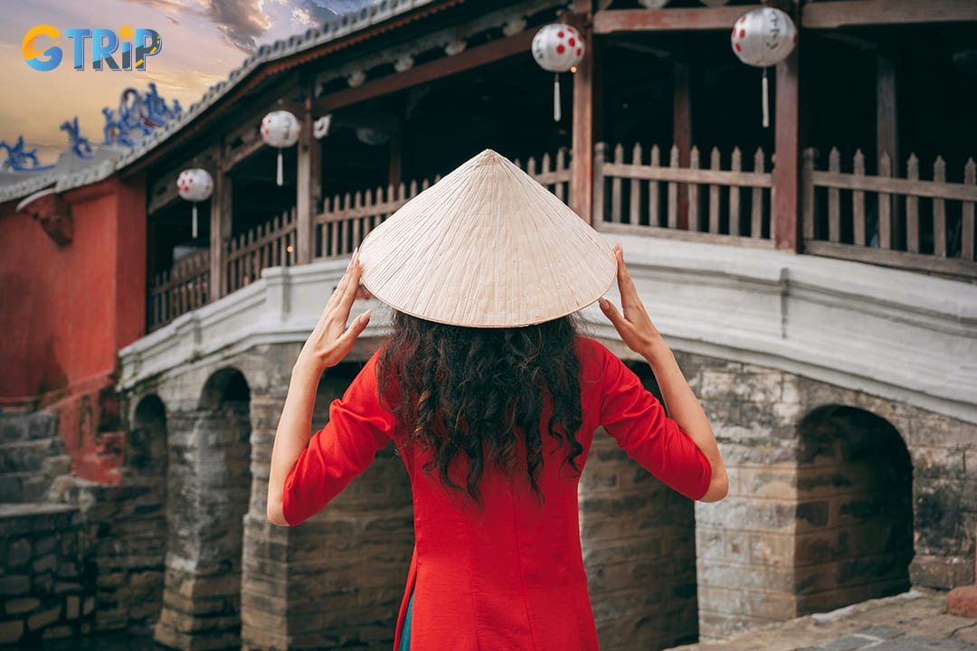 During the day, the bridge’s weathered timbers and serene canal setting make for a timeless, rustic image