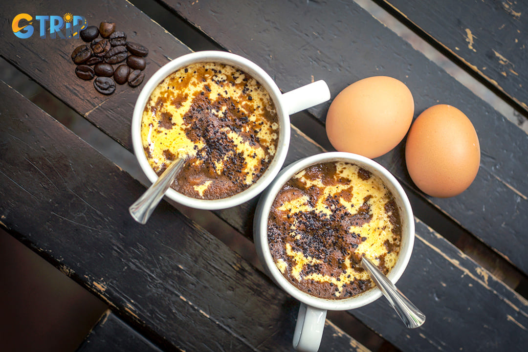 Egg coffee is a decadent beverage combining rich Vietnamese coffee with a creamy, custard-like topping made from whisked egg yolks, sugar, and condensed milk