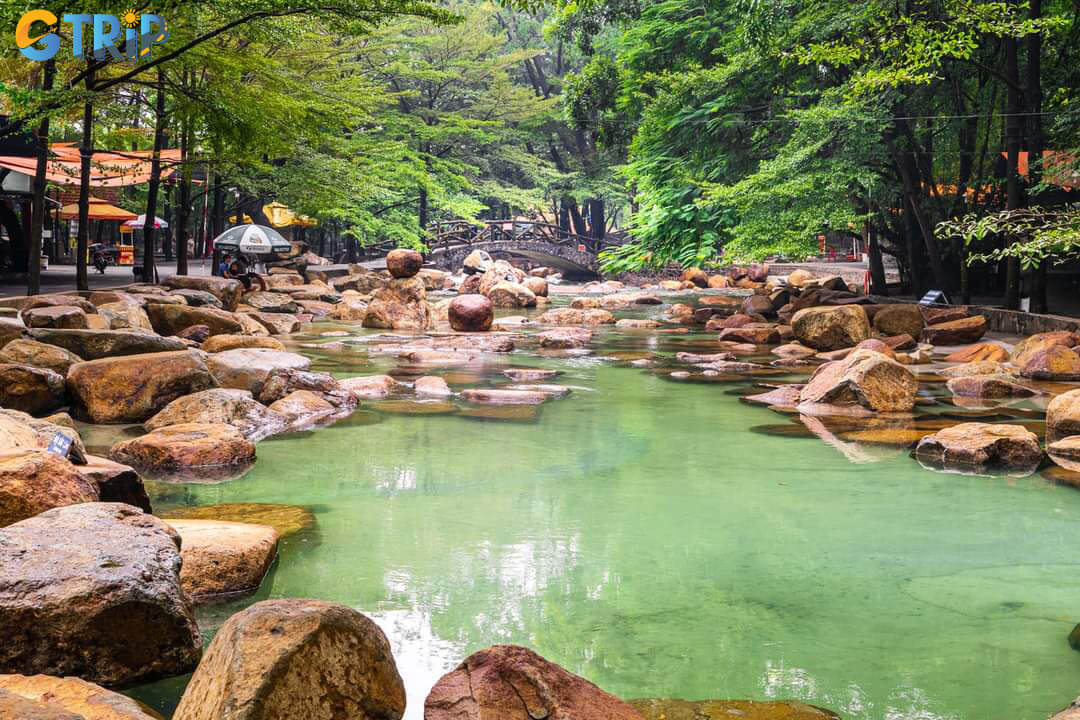 Escape the city heat at Thuy Chau Tourist Area a man-made ecological park with swimming streams, waterfalls, and lush green spaces for relaxation and picnics
