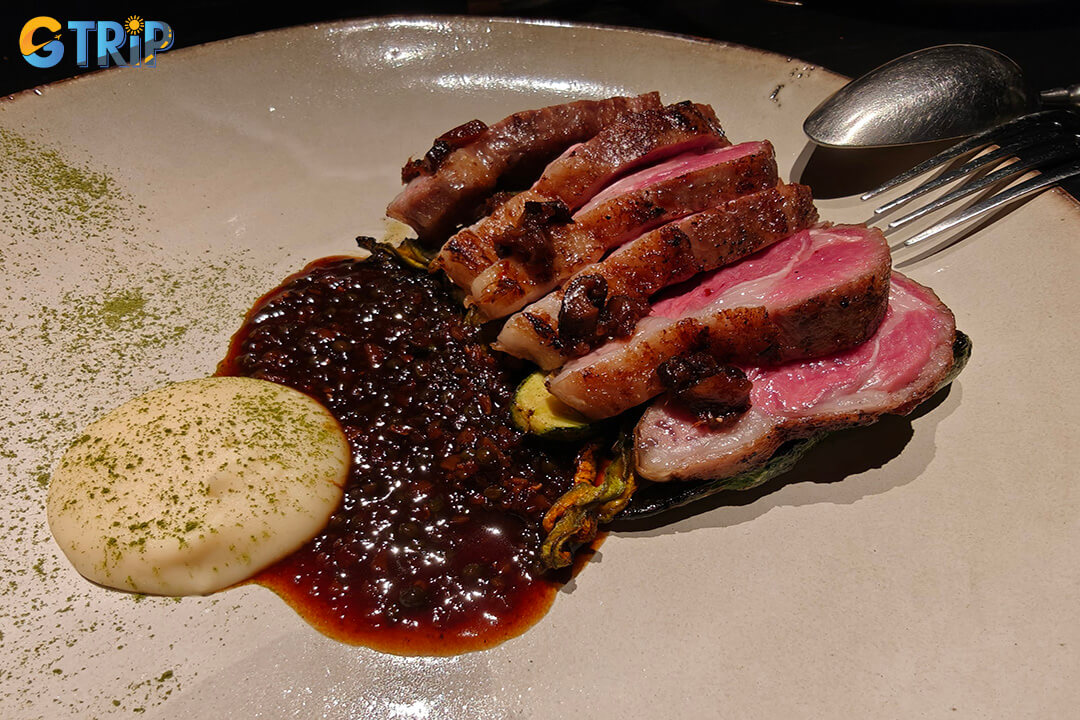 Esta Saigon offers bold, modern Asian cuisine with live-fire cooking, smoky flavors, and a minimalist, intimate setting for adventurous diners