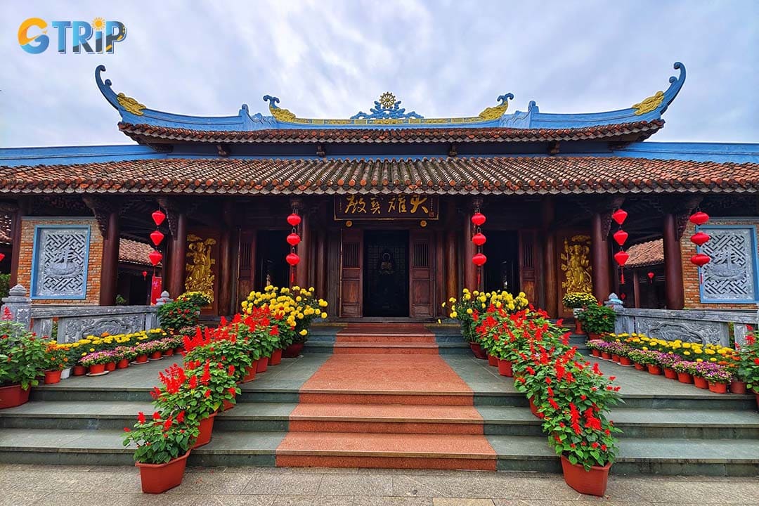 Experience local tranquility at Van Duc Pagoda, a serene temple retreat featuring traditional architecture, and a striking 24.5-meter Quan The Am statue