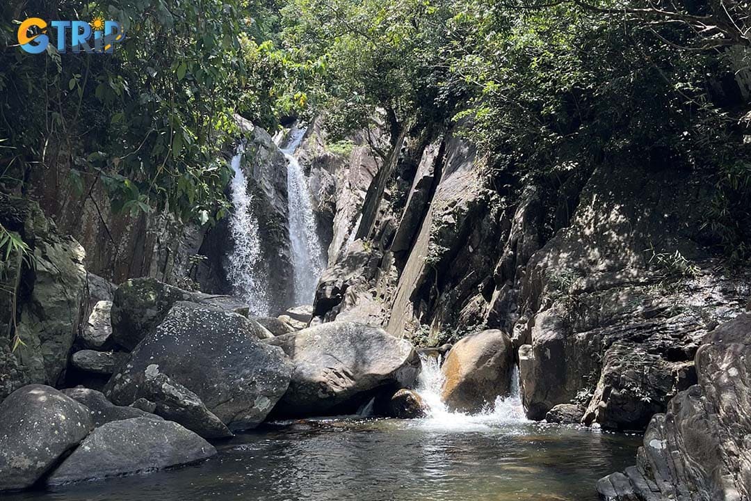 Explore the wild beauty of Ba Do Phot Waterfall on a demanding jungle trail leading to cascading waterfalls, mountain peaks, and untouched forest landscapes