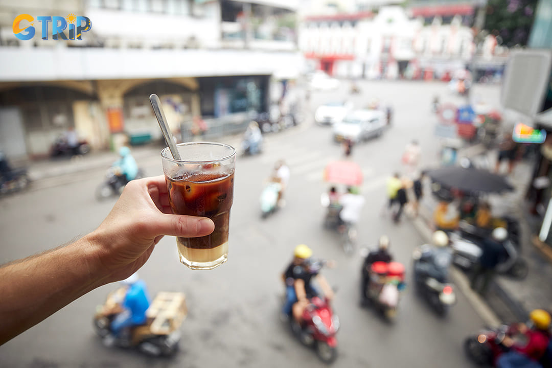 Find a seat at a small streetside cafe, order a Vietnamese iced coffee (ca phe sua da), and watch the world go by