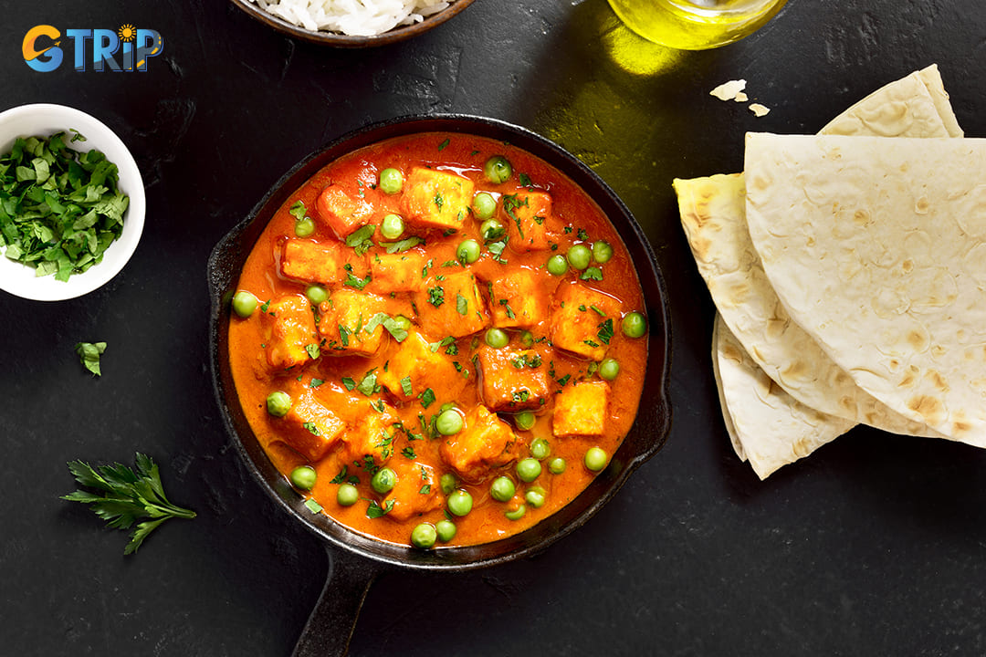 For a vegetarian delight, Paneer Butter Masala is a must-try