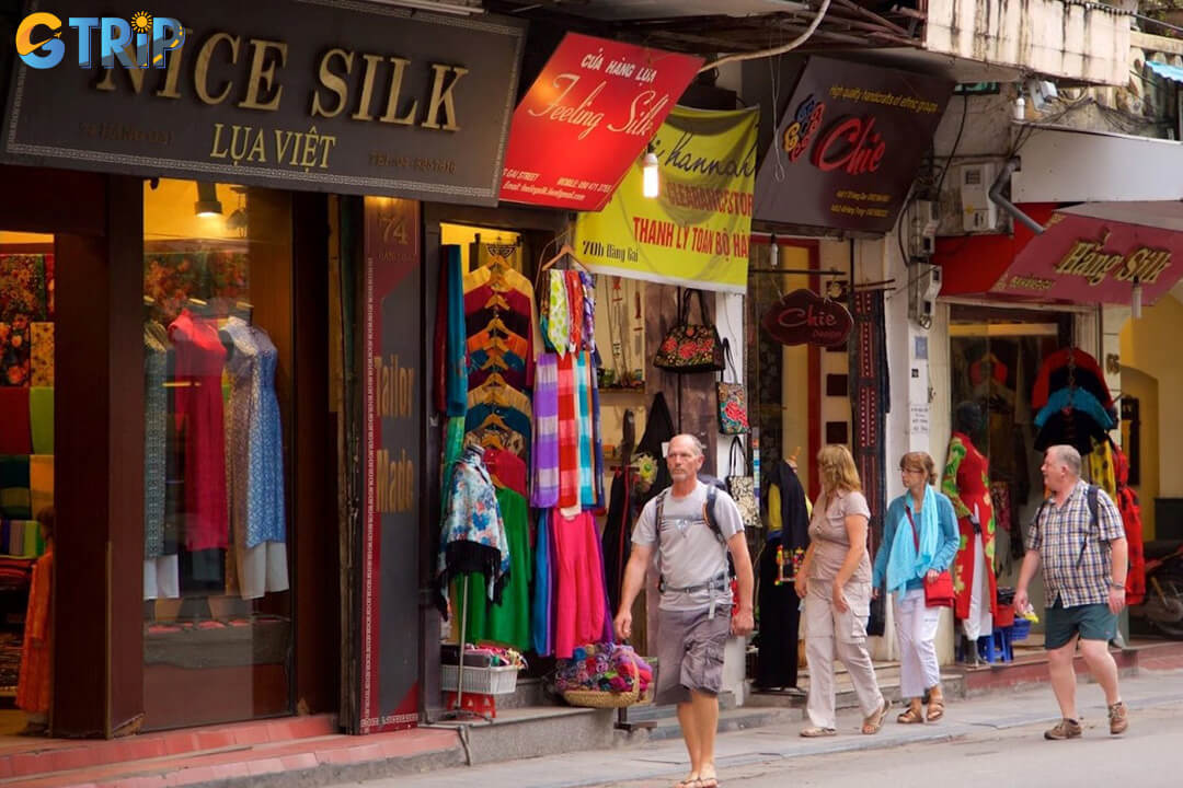 Hang Gai Street is a visual feast for photographers, with colorful silk shops, historic architecture, and vibrant street scenes best captured in the soft morning light