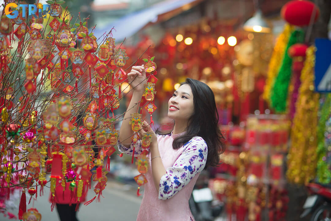 Hang Luoc Street’s narrow lanes, tube houses, and colorful storefronts offer a quintessential Hanoi backdrop for photography