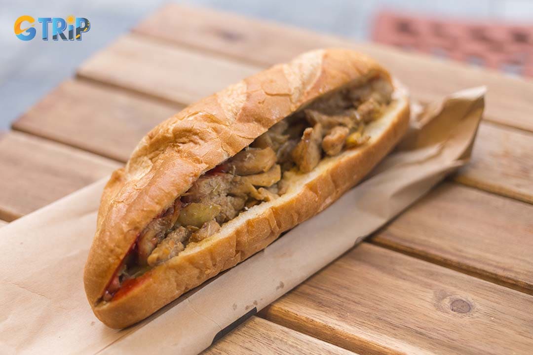 Hanoi’s Banh Mi embodies simplicity and tradition, featuring a denser baguette, rich pork liver pate, and minimal fillings