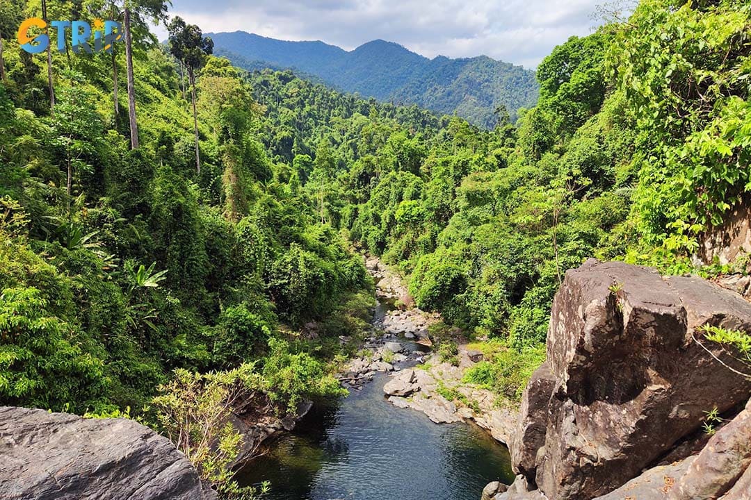 Hike to Gieng Troi for a challenging jungle adventure, rewarded by a secluded waterfall-fed lake perfect for swimming and relaxing in pristine nature