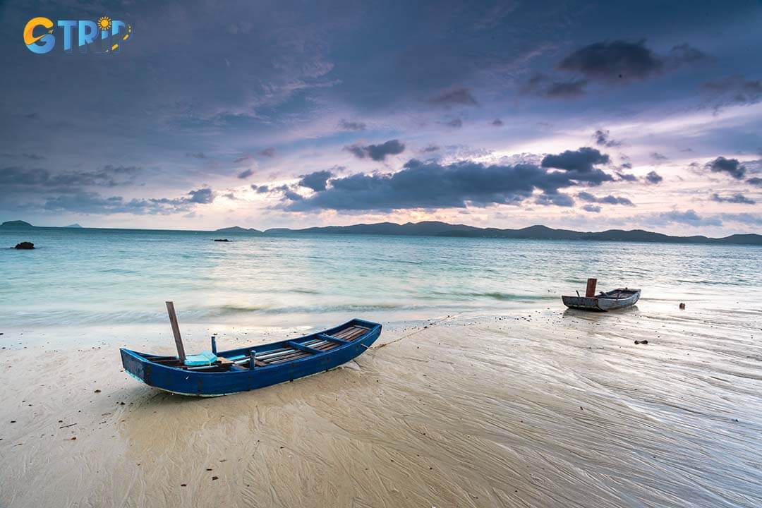 Hong Van Beach is a serene paradise with soft sandy shores, clear shallow waters, and a tranquil atmosphere, perfect for relaxation and nature lovers